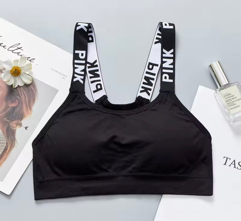 Women's Sports Bra. Black with white letters “PINK”. Stretchy. Wide shoulder straps